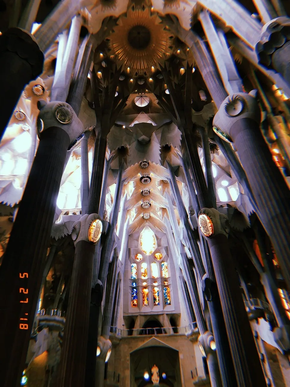 Columns and stained-glass windows inside the Sagrada Família