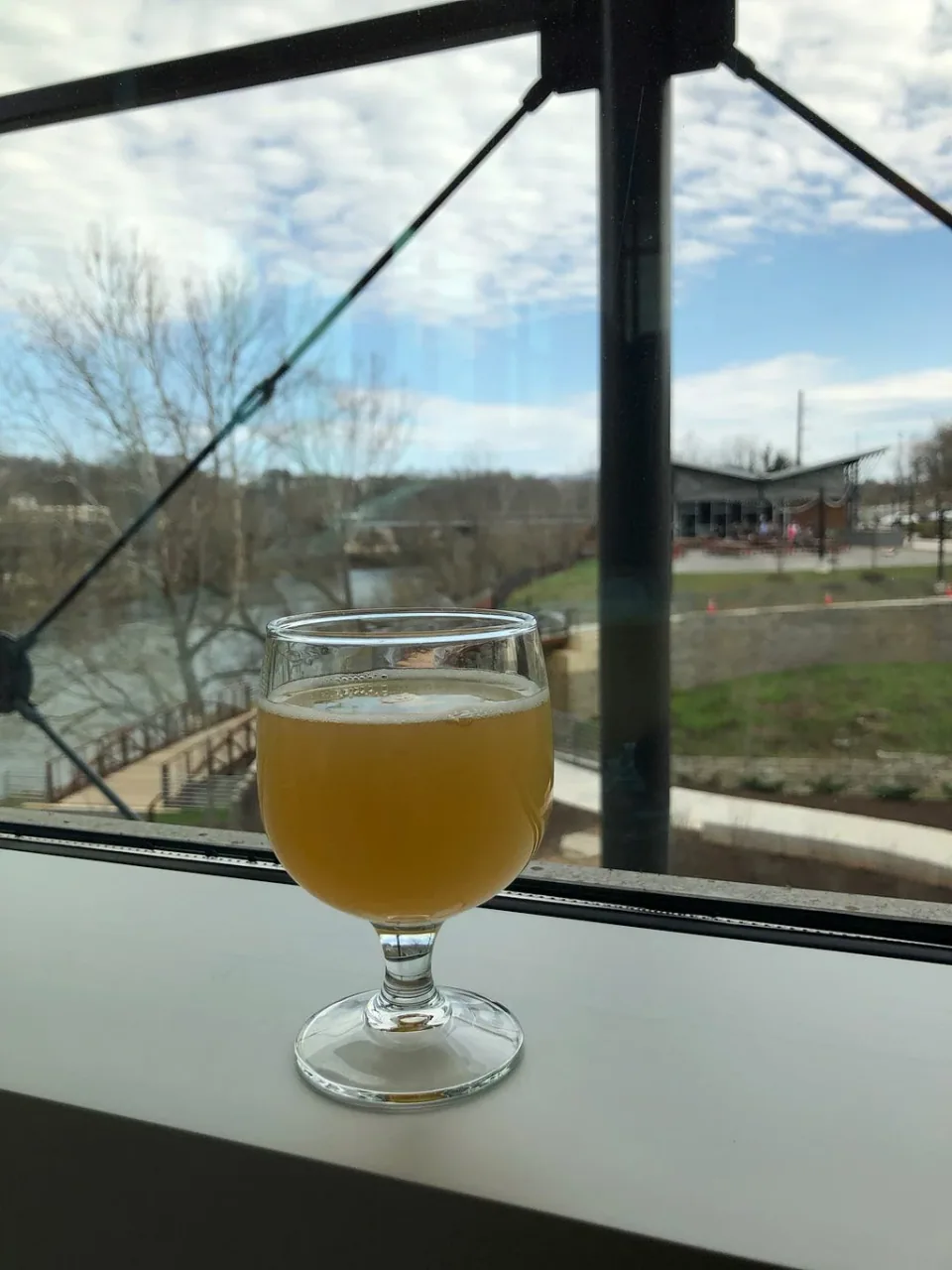 A beer beside a window at the brewery