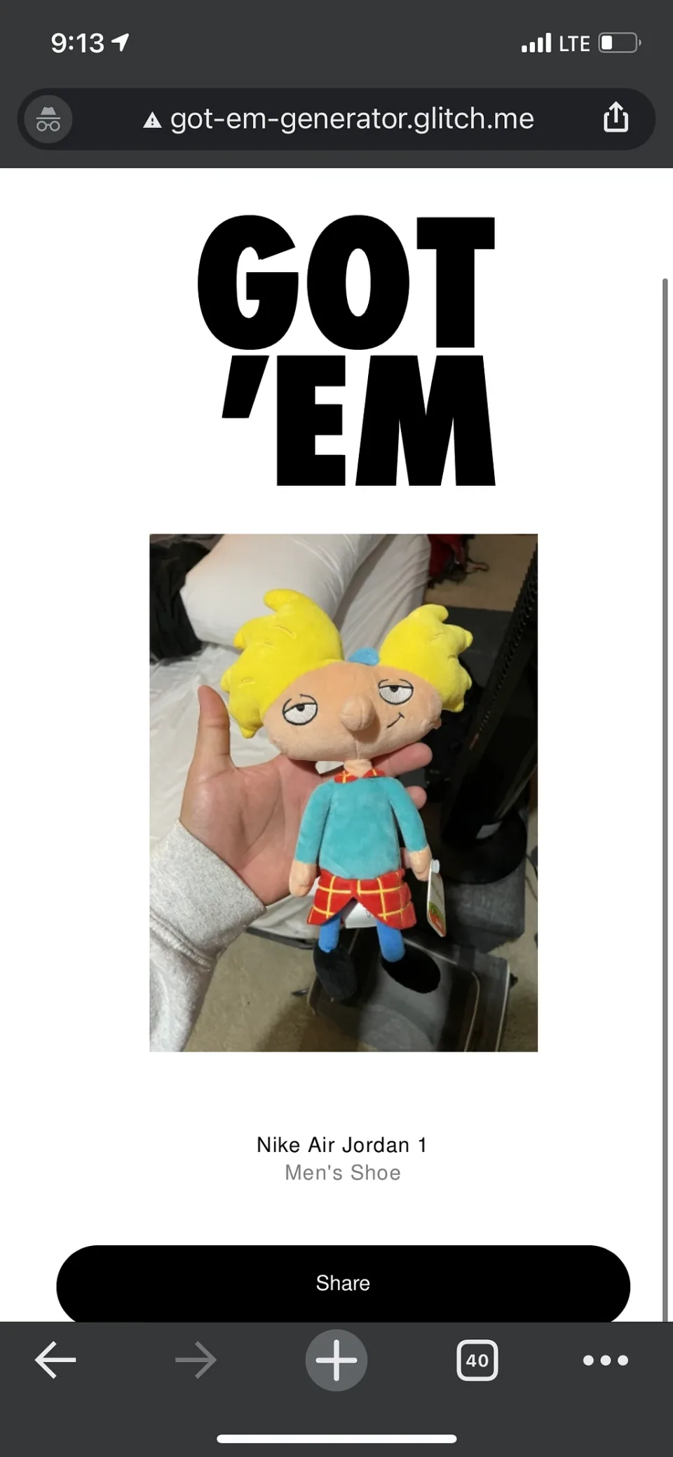 A hand holding a small character figure